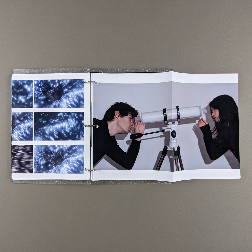 "You are the star" inside spread. Verso: tiled photographs taken through a kaleidoscopic telescope filled with fiber optic lights. Recto: A foldout photograph of a man and woman looking at each other through a two-way telescope. 