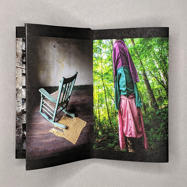 A 2-panel spread of the accordion book, opened like a codex. On the left is a photo of a rocking chair crushing an array of crackers on the floor of a distressed room. On the right is a photo of three blouses buttoned onto a tree trunk in the woods.